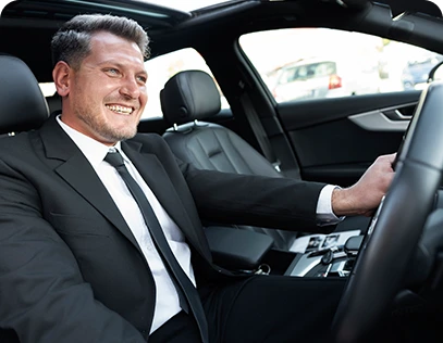 Professional chauffeur providing luxury airport and destination transportation service.