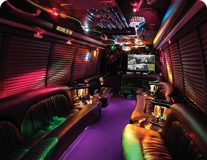 Luxury party bus interior with LED lighting, premium seating, and entertainment system.