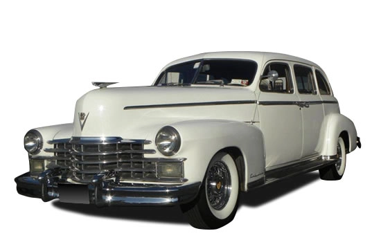 Classic white Cadillac vintage limousine for wedding transportation.